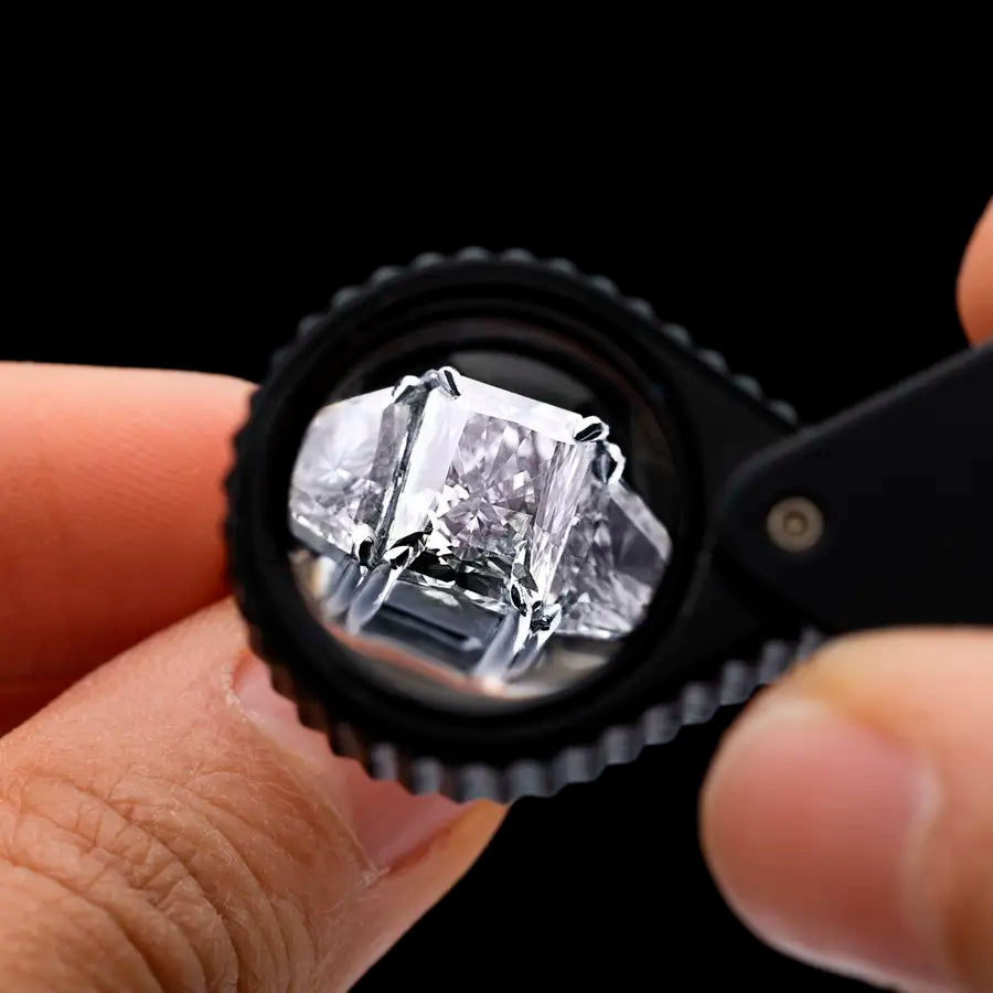 Jeweler cleaning and polishing a diamond ring at Joe Kassab Jewelers in Happy Valley, Oregon